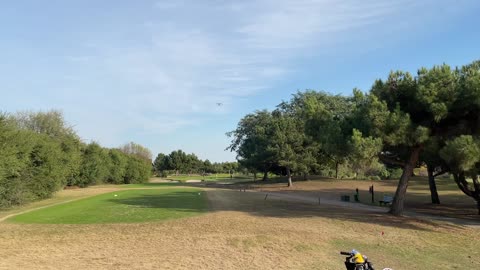 plane fly over Skylinks Golf course