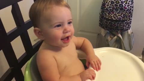 Cute baby has grunting contest with her dad