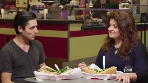 9_Alex Guarnaschelli Tries the Famous Roast Pork Sandwich from