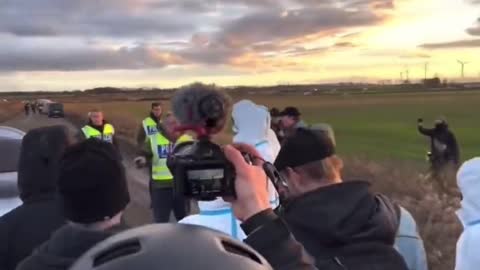 Masked militants chant a BLM-Antifa slogan