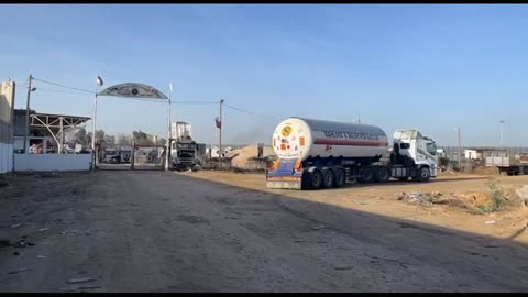 Fuel trucks enter the Rafah border crossing as truce starts