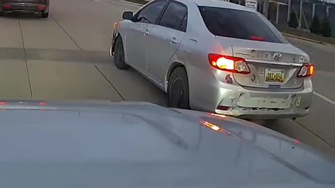 The dash cam guy had his beam lights on and didn't want to let the car merge..