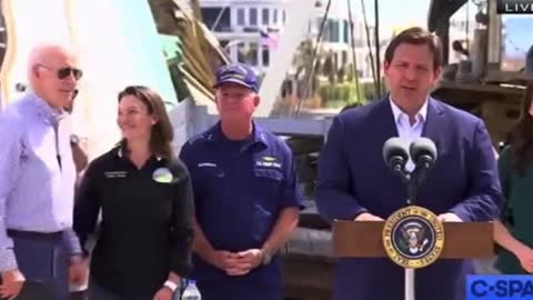 Grinning Joe Biden Creeps on Female FEMA Official as Governor DeSantis is Speaking