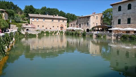 Bagno Vignoni, Tuscany, Italy. August 2020. View on the water mirror of the spring basin