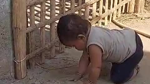 Baby playing with sand