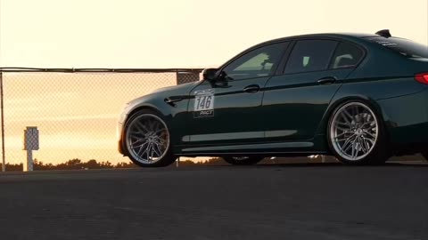 Perfect BMW on a rooftop at sunset