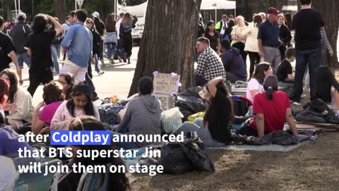 BTS fans camp out to see superstar Jin perform with Coldplay | AFP