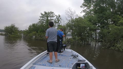 Father Hooks Son's Hat while Fishing