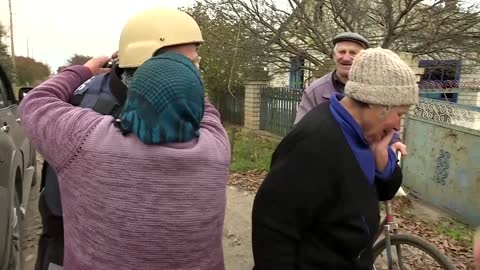 Tears of joy as Kherson villagers greet reporters