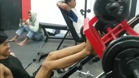 strongest man doing leg press in gym 100 kg