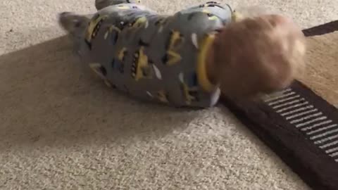 Cute baby rolling all over