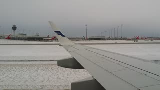 Finnair ERJ 195 landing at Munchen airport.