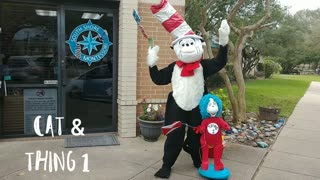See this mascot party character hat cat poses for pictures with thing 1 at a Dr.suess birthday party