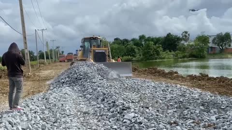 New bulldozer spreading gravel processing features building road foundation-17