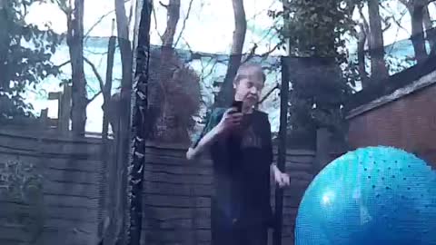 Double bouncing water bucket on trampoline
