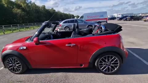 Huge Husky Loves To Ride in His Mini Convertible!