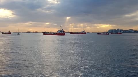 Beautiful sea landscape with clouds, sunset and ships