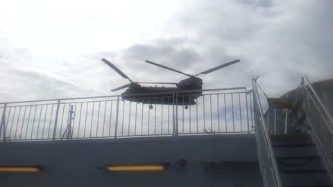 Royal Marines Playing with their Chinooks over our passenger ferry