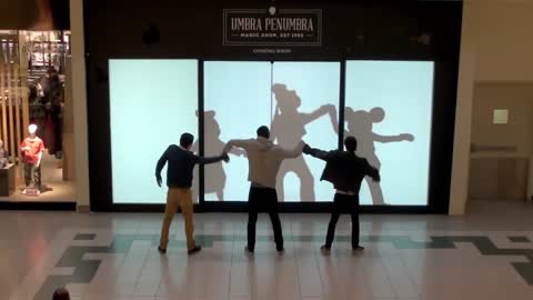 Disney characters challenge shoppers to dance battle