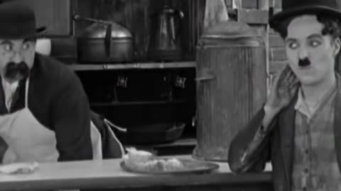 Charlie Chaplin's Sneaky Supper: A Comedy of Culinary Thievery!