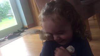toddler laughing at chick