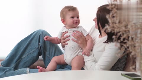 The child is very happy to play with his mother