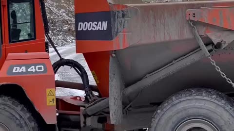 Doosan DX800LC loading a DA40 truck a few years ago