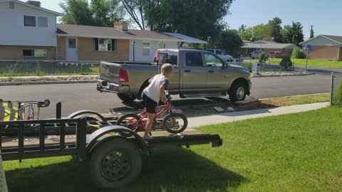 Son Jumping Bike off Trailer Faceplants