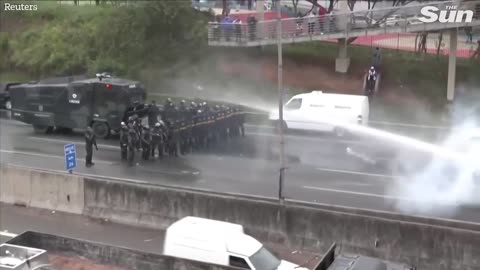 Brazilian police fire water cannons and rubber bullets at anti Lula protesters