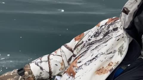 Wind Pushes Ice Fisherman Across Frozen Lake