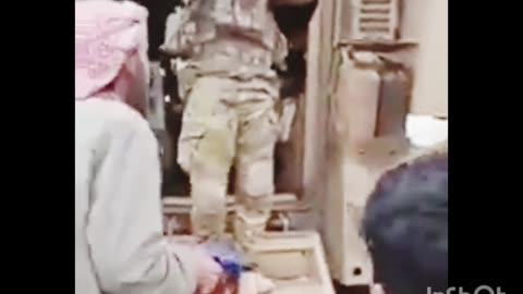 A video shows an unarmed Syrian citizen removing the American flag from an American armored vehicle