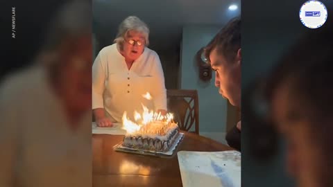 Grandma's unable to blow out dozens of candles, uses a towel instead