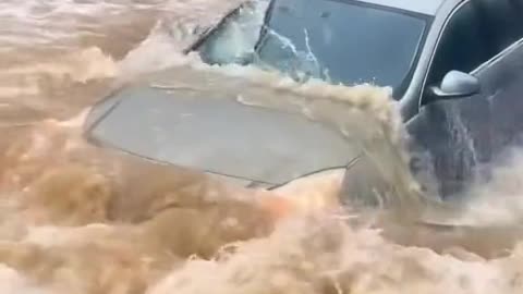 Vehicles passing through the stagnant water area