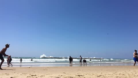 Playing Tennis At The Beach