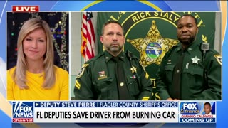 Florida police officers hailed as heroes after rescuing driver from burning car