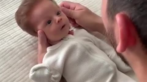 dad gently combing son's hair