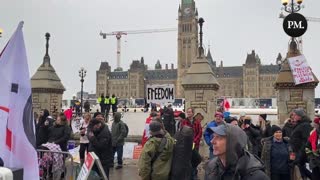 Protestors chant “freedom,” “love,” and “world peace” at Parliament Hill in Ottawa.