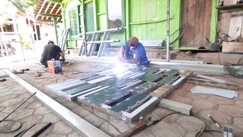 how welders work in Indonesia to make a minimalist gate