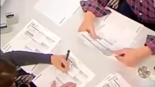 2020 poll worker filling in empty ballots