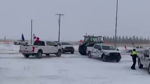 Farmers break through RCMP barricades setup near Coutts, Alberta to support blockade.