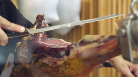 Butcher Slicing Ham