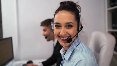 A pair of employees working in a call center