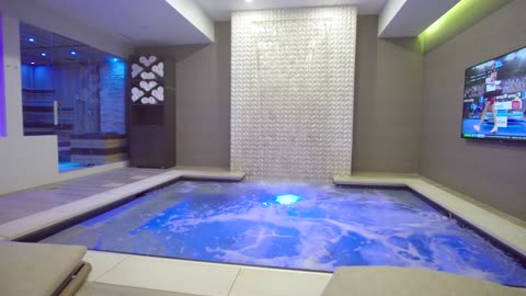 Luxurious Home Spa and Theater - Waterfall, Hot Tub, Sauna, Shower, Gym, and Lounge Seating