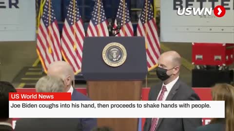 Joe Biden coughs into his hand, then proceeds to shake hands with people.
