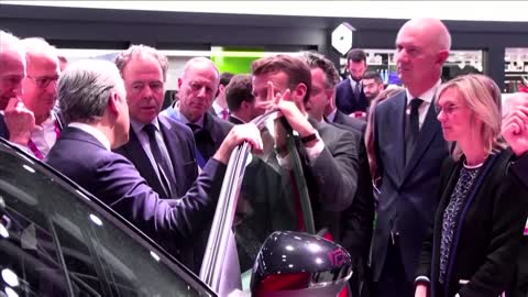 Macron announces bigger EV subsidies at Paris auto show