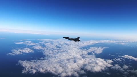 A pair of MiG-31BM fighter jets of the Pacific Fleet train to intercept an intruder aircraft