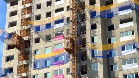 a lift up and down the high-rise construction site