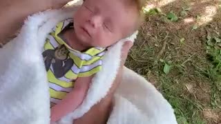 New born baby boy enjoys head massage