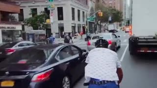 Dude bikes through traffic and finds out