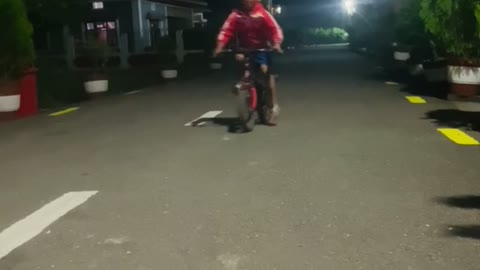Cute boy showing cycle stunt